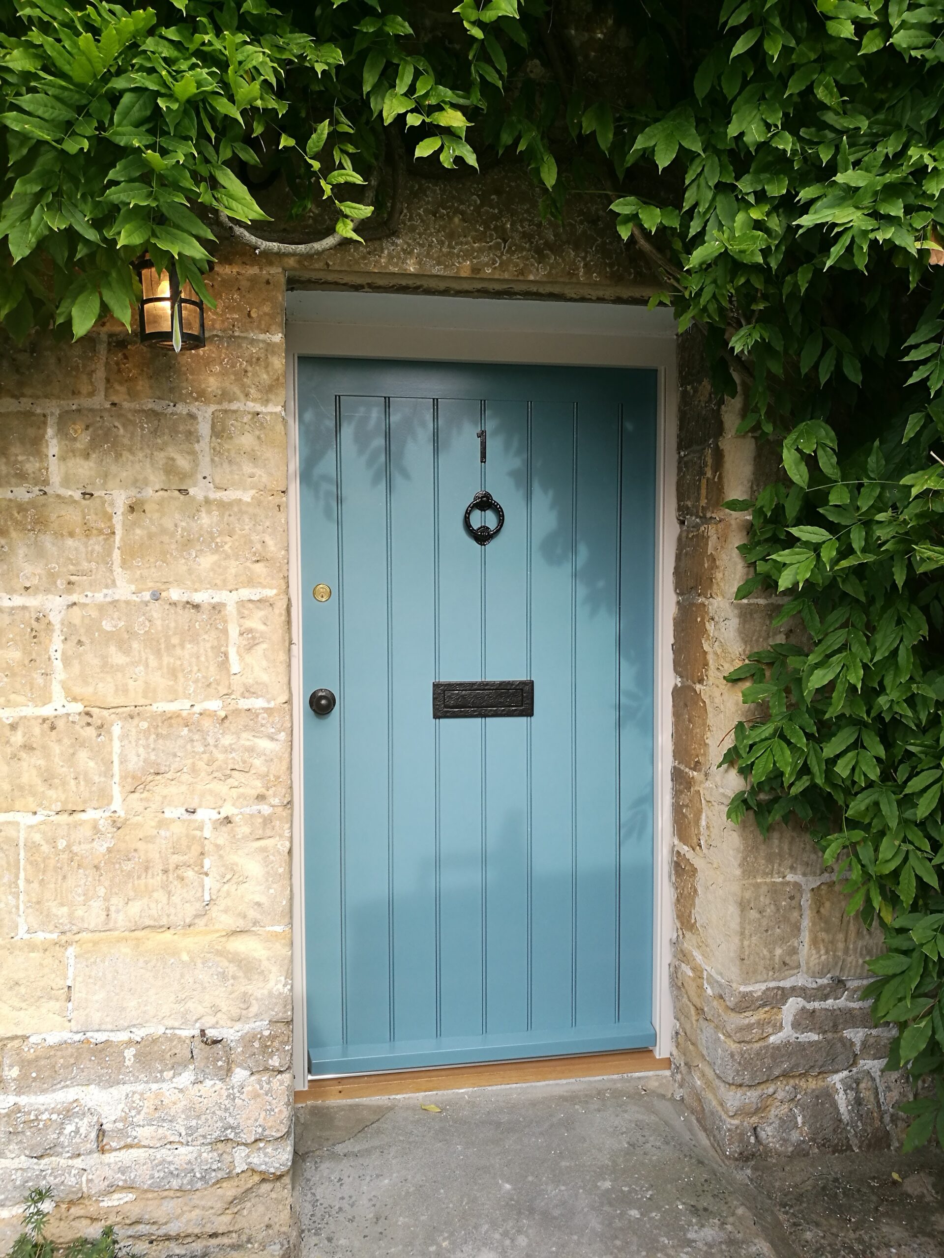 Blue timber entrance door by Kings Stag Joinery