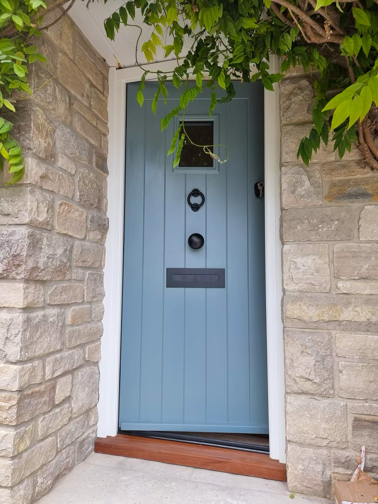 Blue timber entrance door by Kings Stag Joinery