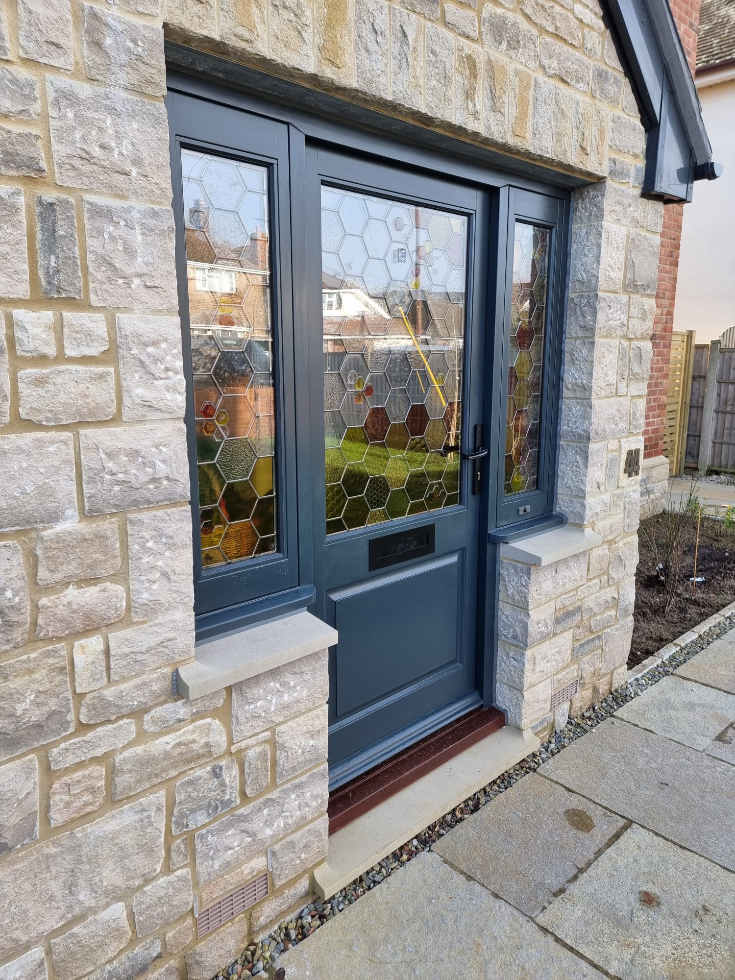 Dark blue timber entrance door by Kings Stag Joinery