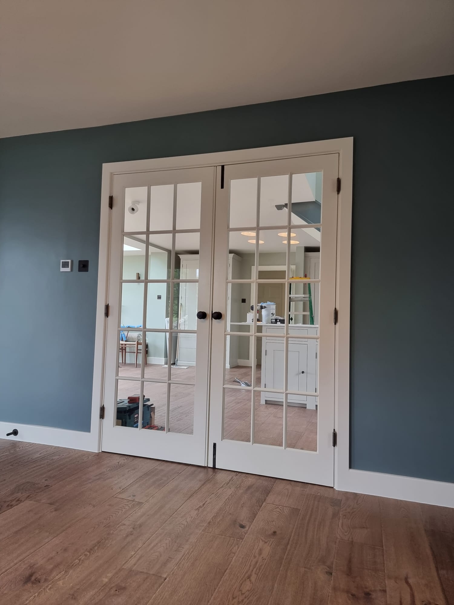 White timber and glass internal double door by Kings Stag Joinery